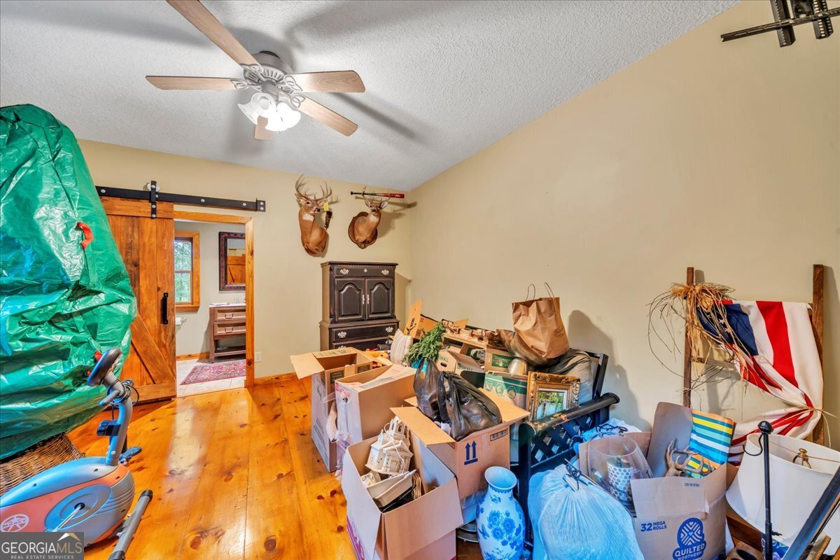 568 Hopewell Church Road Rhine, GA 31077 - Photo 36 of 77 a living room with furniture and a flat screen tv