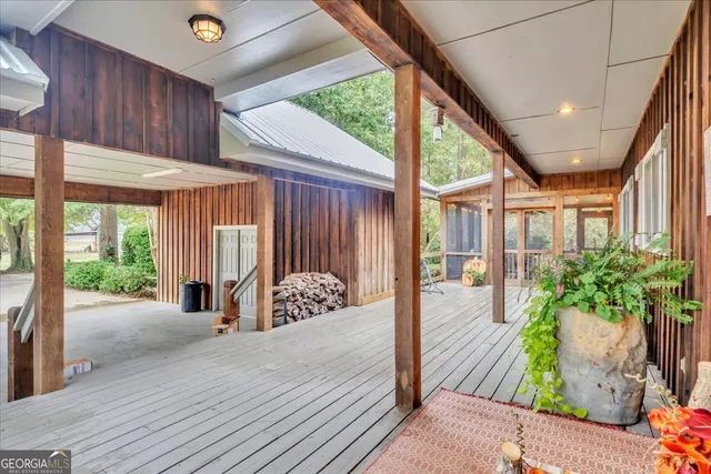 a backyard of a house with plants and tree