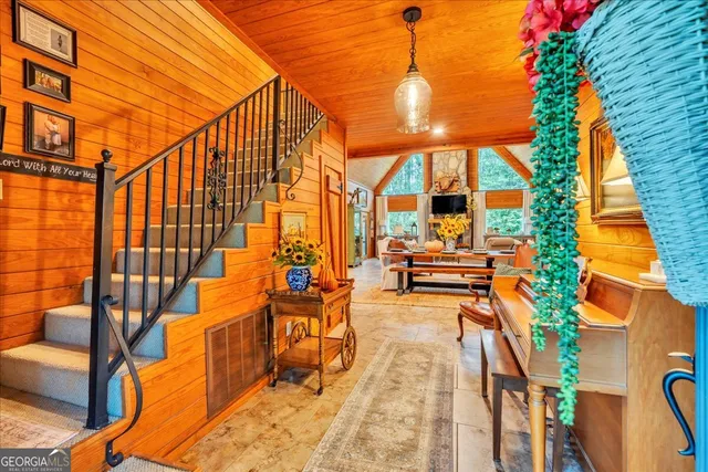 an aerial view of a house with swimming pool and glass doors