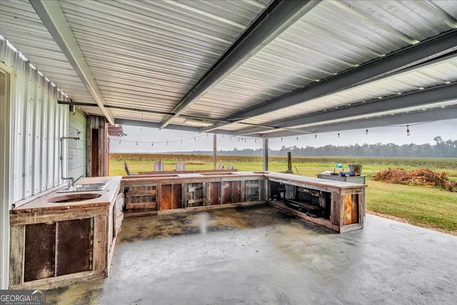 a aerial view of a house with swimming pool next to a yard