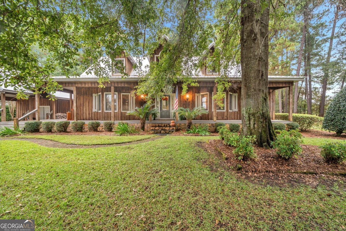 568 Hopewell Church Road Rhine, GA 31077 - Photo 56 of 77 front view of a house with a yard