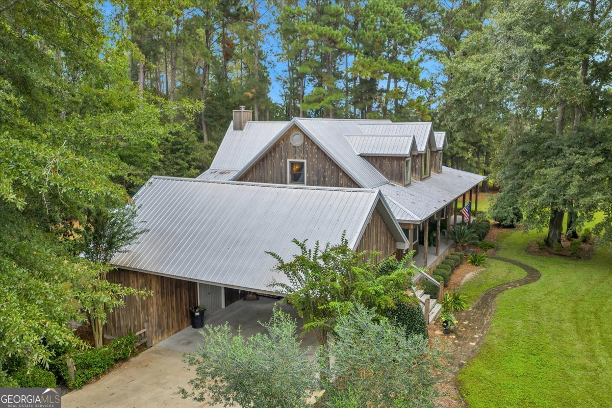 568 Hopewell Church Road Rhine, GA 31077 - Photo 67 of 77 a aerial view of a house with a yard table and chairs