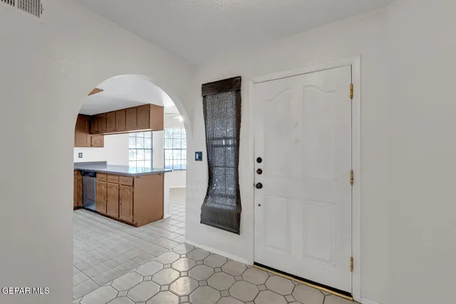 a kitchen with stainless steel appliances a refrigerator and a stove