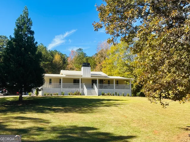 a view of a house with swimming pool