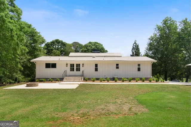 a front view of house with garden