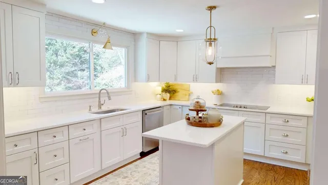 a kitchen with a sink cabinets and window