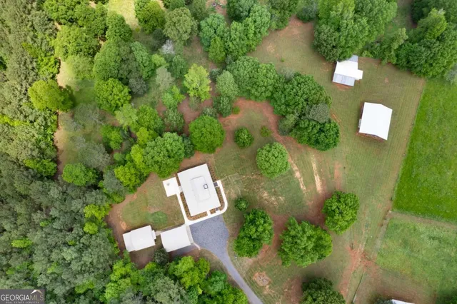 an aerial view of a house with outdoor space and street view