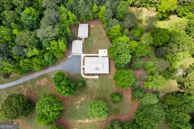 an aerial view of a house with a garden