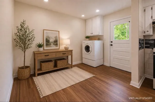 a view of kitchen with furniture wooden floor and window