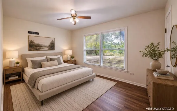 a bedroom with a large bed and a window