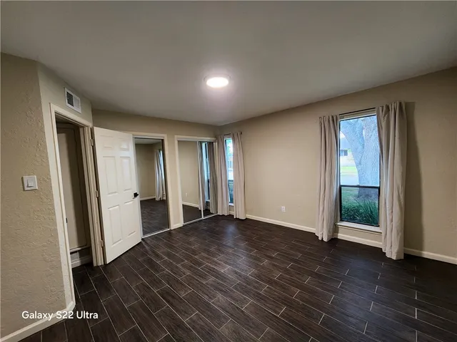 a backyard of a house with a garden