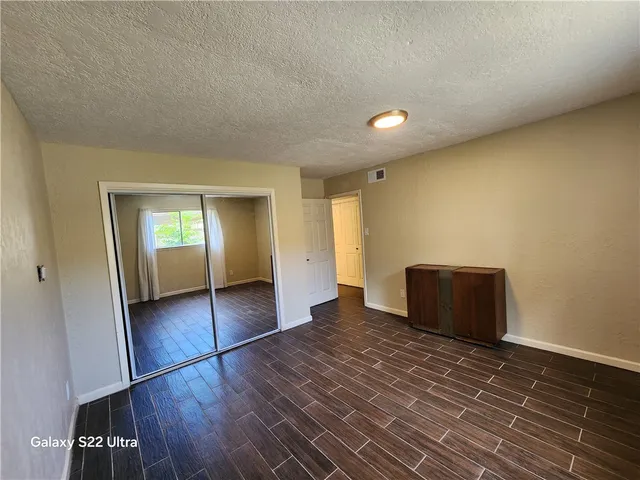a view of a house with a yard and garage