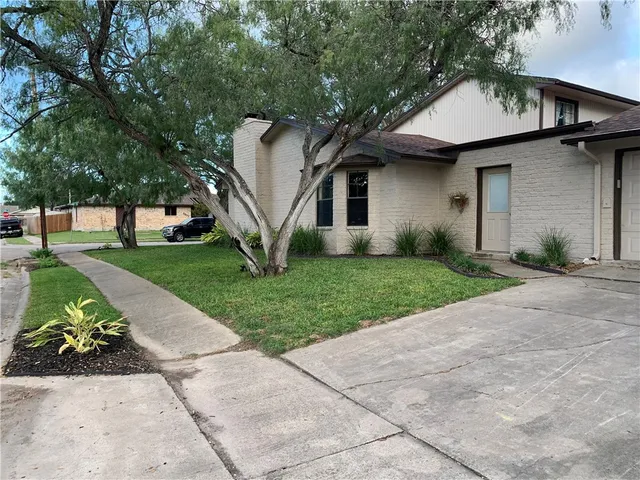 a living room with furniture fireplace and a flat screen tv