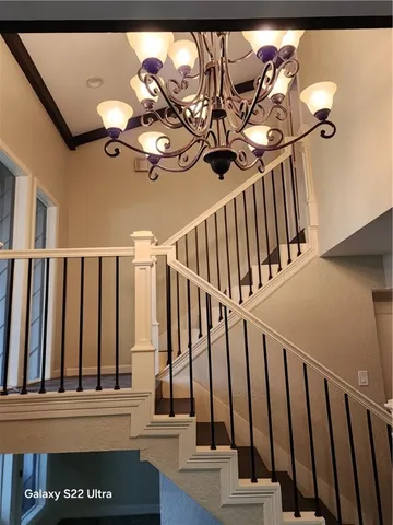 a view of staircase with wooden floor