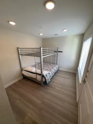 a room with a bed and a mirror