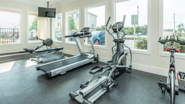 a view of a bedroom with table and chair