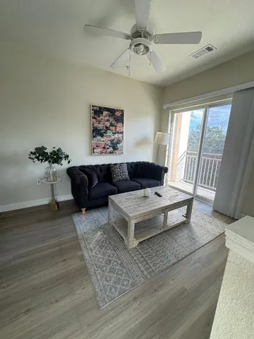 a living room with furniture and a rug