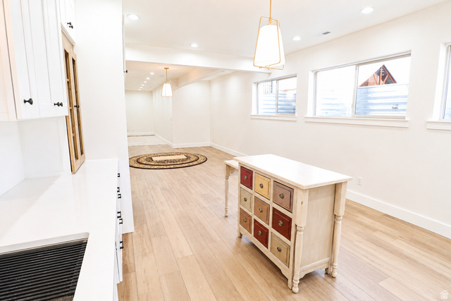 1055 North 1000 East Mapleton, UT 84664 - Photo 55 of 112 Recessed lighting illuminates an expansive room featuring wood-finish flooring and multiple windows