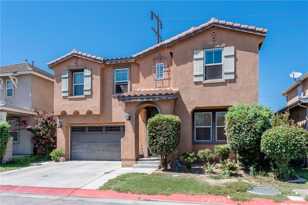 1811 Julia Way Riverside, CA 92501 - Photo 1 of 1 a front view of a house with a garden