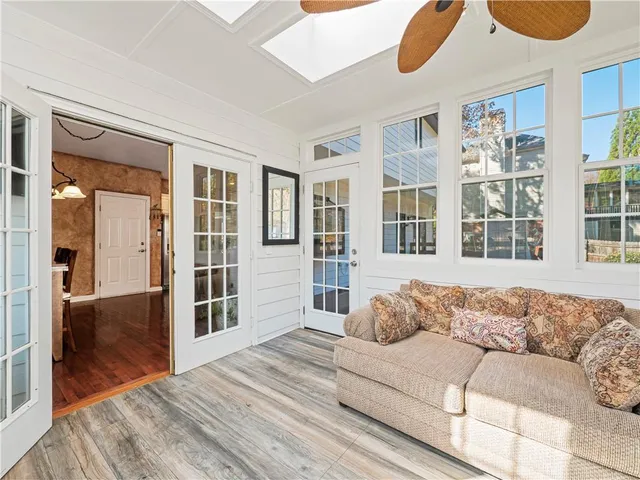 a living room with furniture and windows
