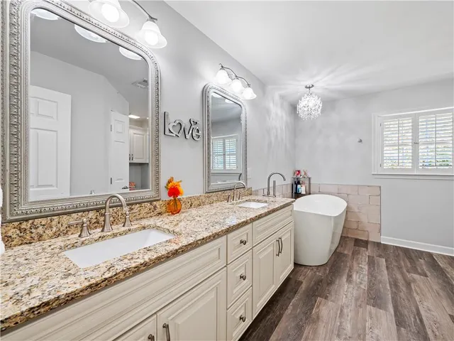 a bathroom with a glass shower door