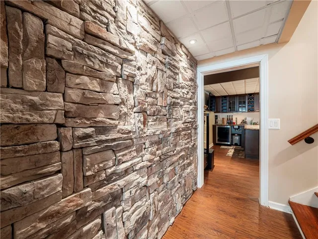 a room with furniture and pool table