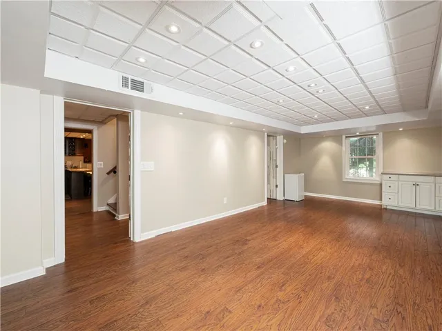 a view of a deck with wooden floor and seating space
