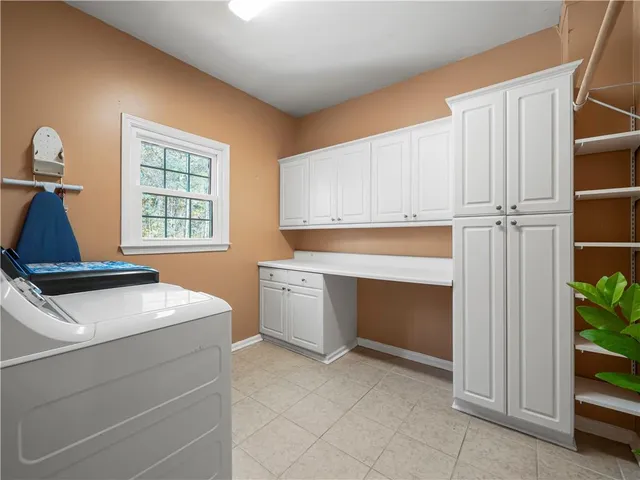 a view of kitchen and utility room with closet