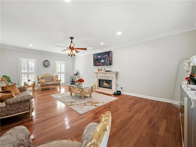 a kitchen with wooden floors and white appliances