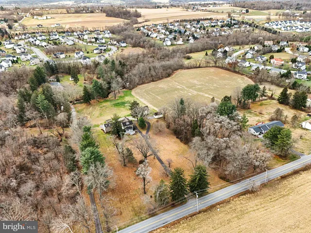 a kitchen with appliances a sink and cabinets