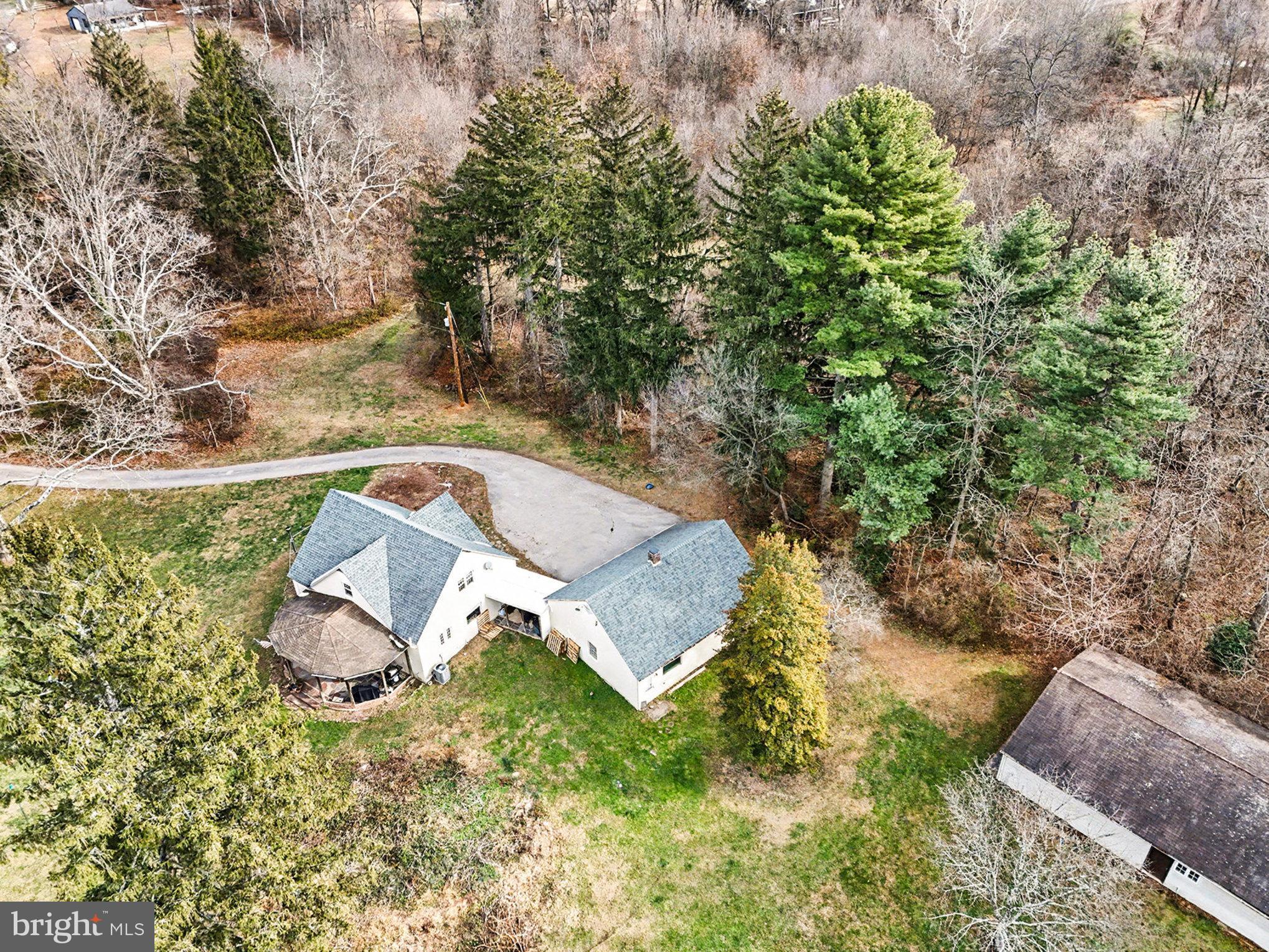 284 Stony Run Road Spring City, PA 19475 - Photo 55 of 70 a view of a backyard with plants and a tree