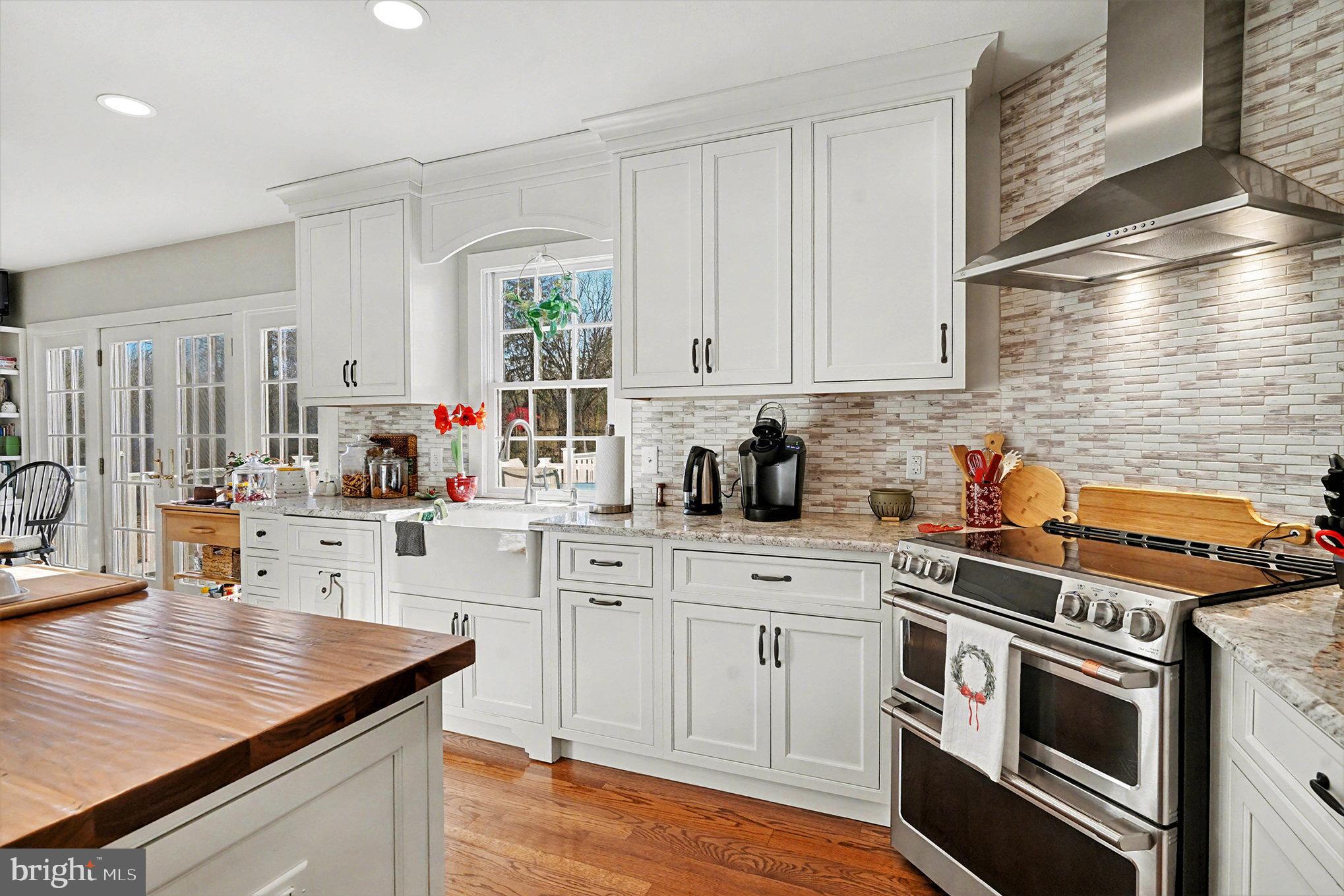 284 Stony Run Road Spring City, PA 19475 - Photo 10 of 70 a kitchen with stainless steel appliances white cabinets and a stove top oven