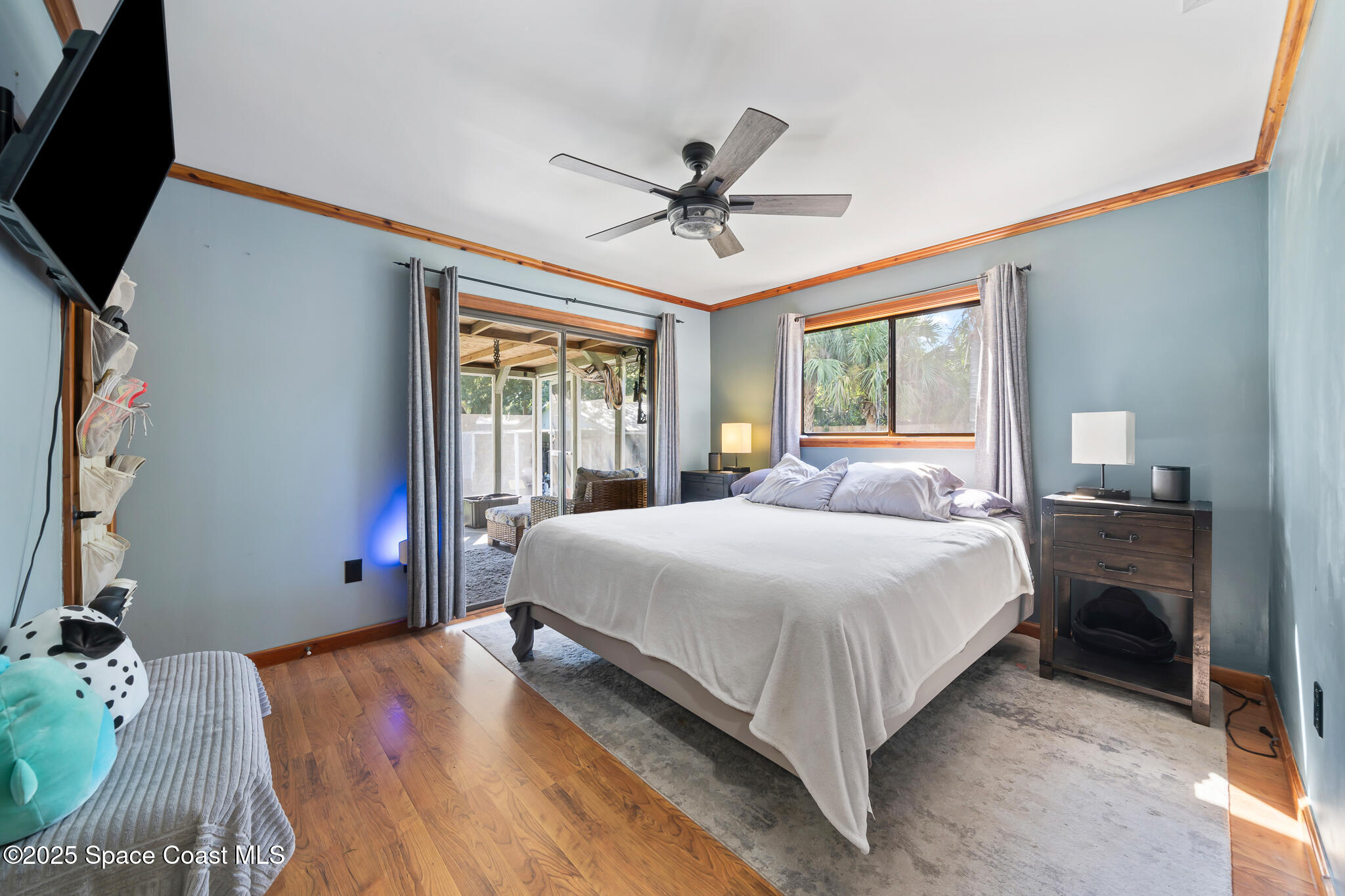 9633 Honeysuckle Drive Sebastian, FL 32976 - Photo 15 of 40 a bedroom with a large bed and a window