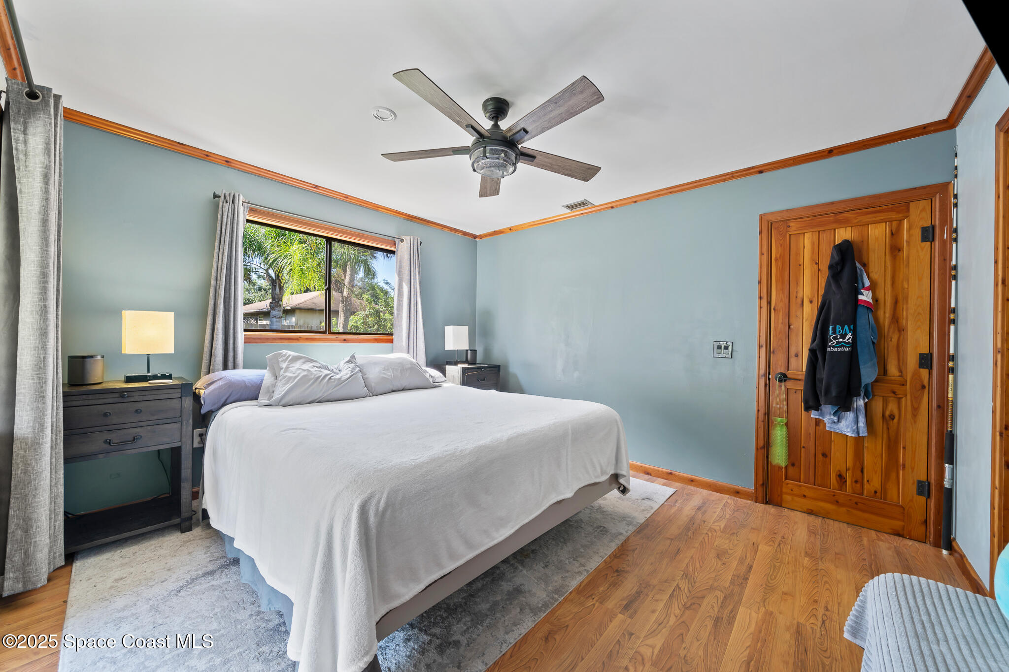 9633 Honeysuckle Drive Sebastian, FL 32976 - Photo 16 of 40 a bedroom with a bed and window