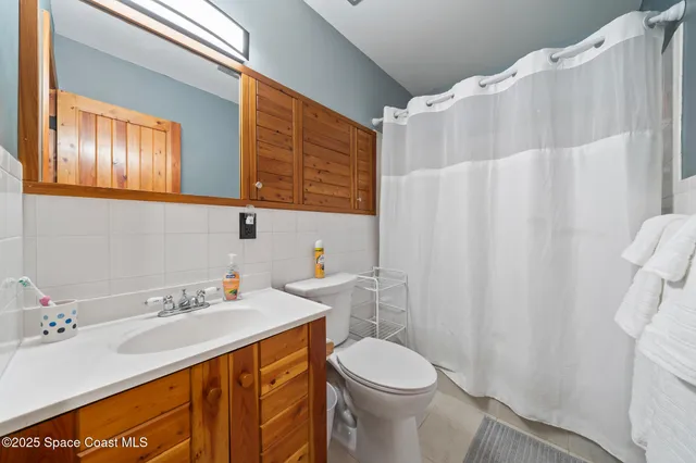 a kitchen with stainless steel appliances a stove a refrigerator and cabinets