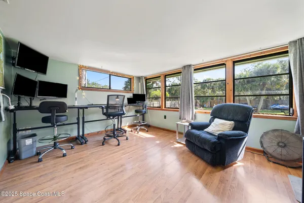 a bedroom with furniture and a window