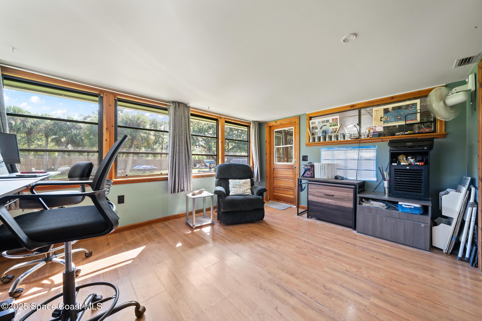 9633 Honeysuckle Drive Sebastian, FL 32976 - Photo 22 of 40 a bedroom with furniture and a window