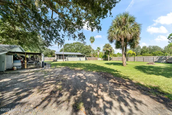 a view of swimming pool with outdoor seating and yard