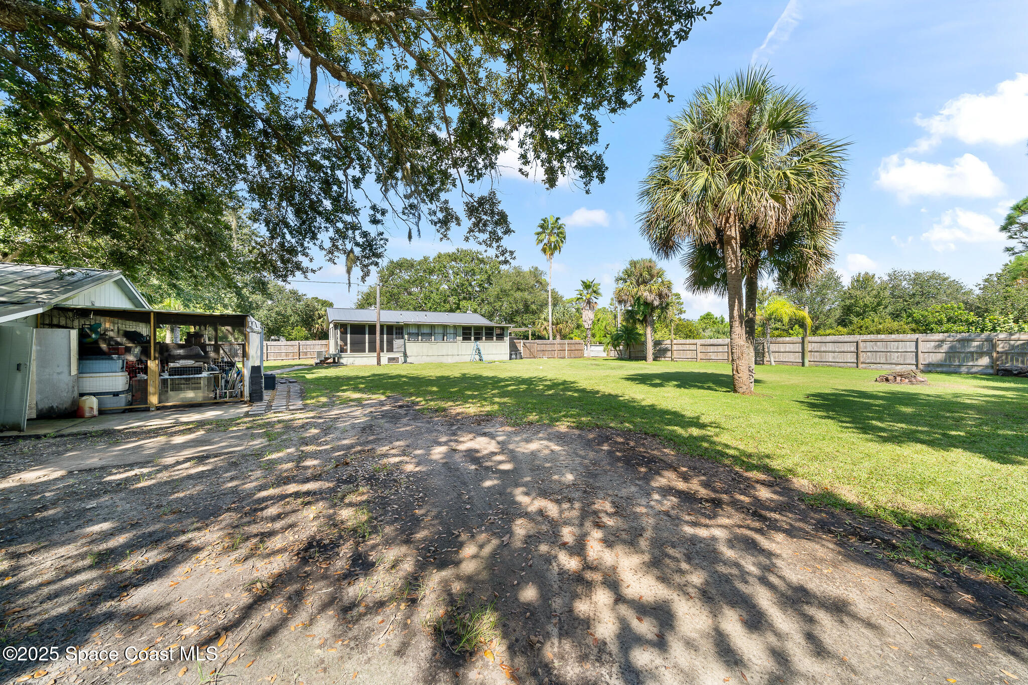 9633 Honeysuckle Drive Sebastian, FL 32976 - Photo 26 of 40 a view of a park with large trees