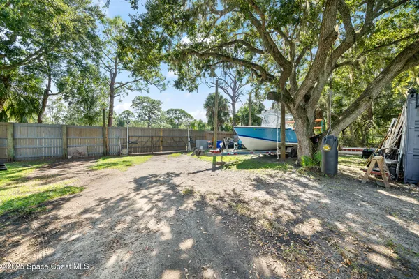 a view of a barn in the back yard