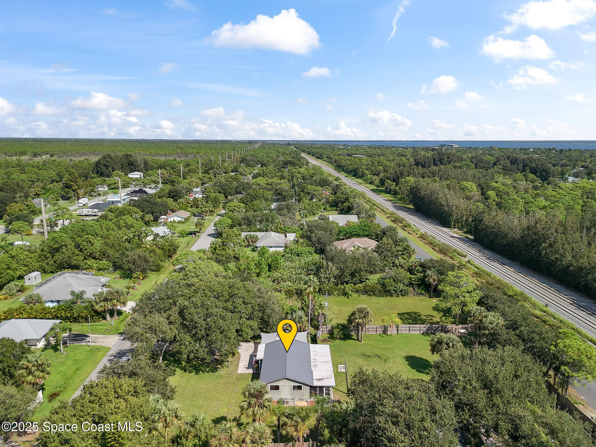 9633 Honeysuckle Drive Sebastian, FL 32976 - Photo 3 of 40 an aerial view of a houses with outdoor space