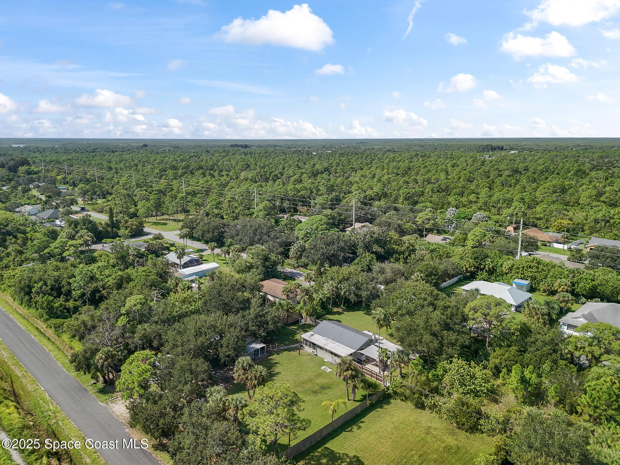 9633 Honeysuckle Drive Sebastian, FL 32976 - Photo 36 of 40 an aerial view of residential houses with outdoor space and trees