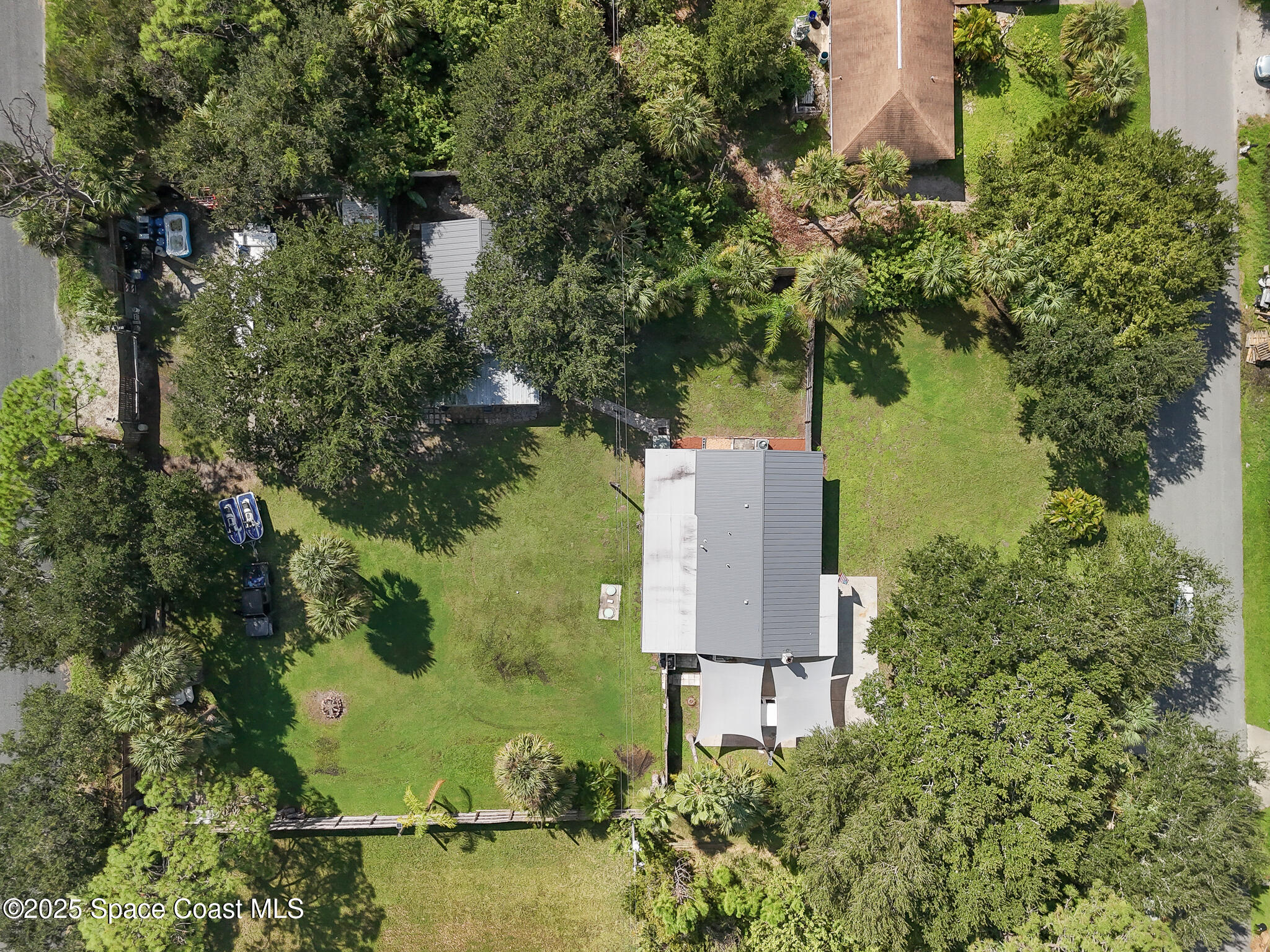 9633 Honeysuckle Drive Sebastian, FL 32976 - Photo 39 of 40 an aerial view of a house with a yard and lake view