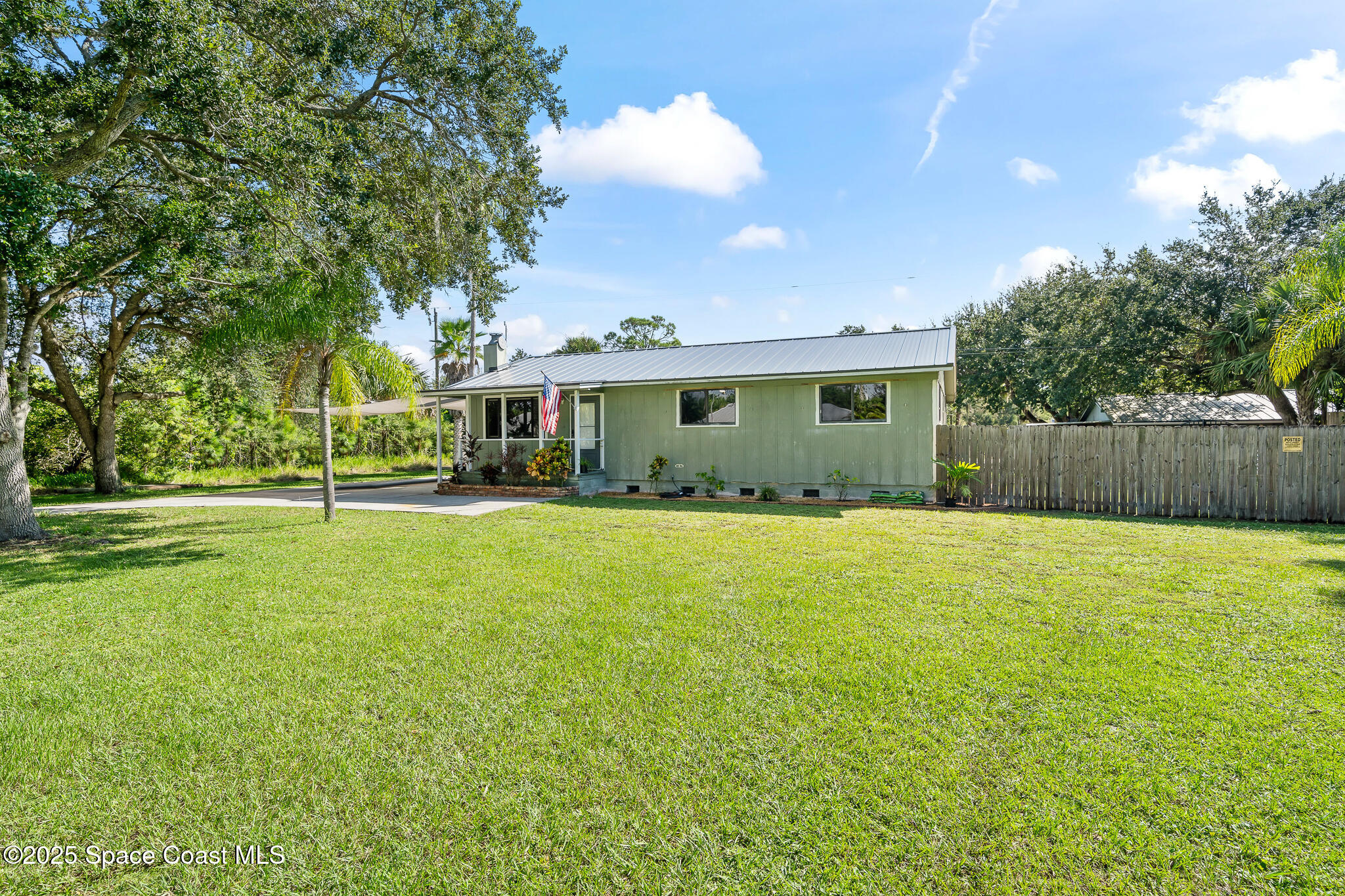 9633 Honeysuckle Drive Sebastian, FL 32976 - Photo 4 of 40 a view of a house with a backyard