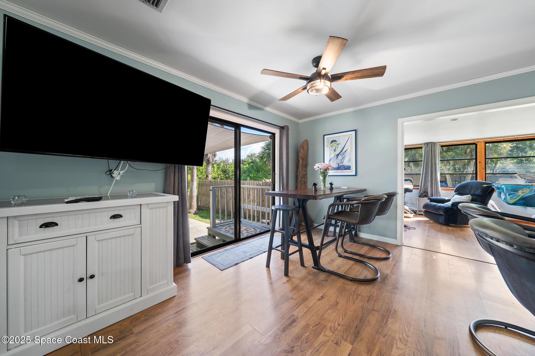 9633 Honeysuckle Drive Sebastian, FL 32976 - Photo 8 of 40 a living room with furniture and a large window