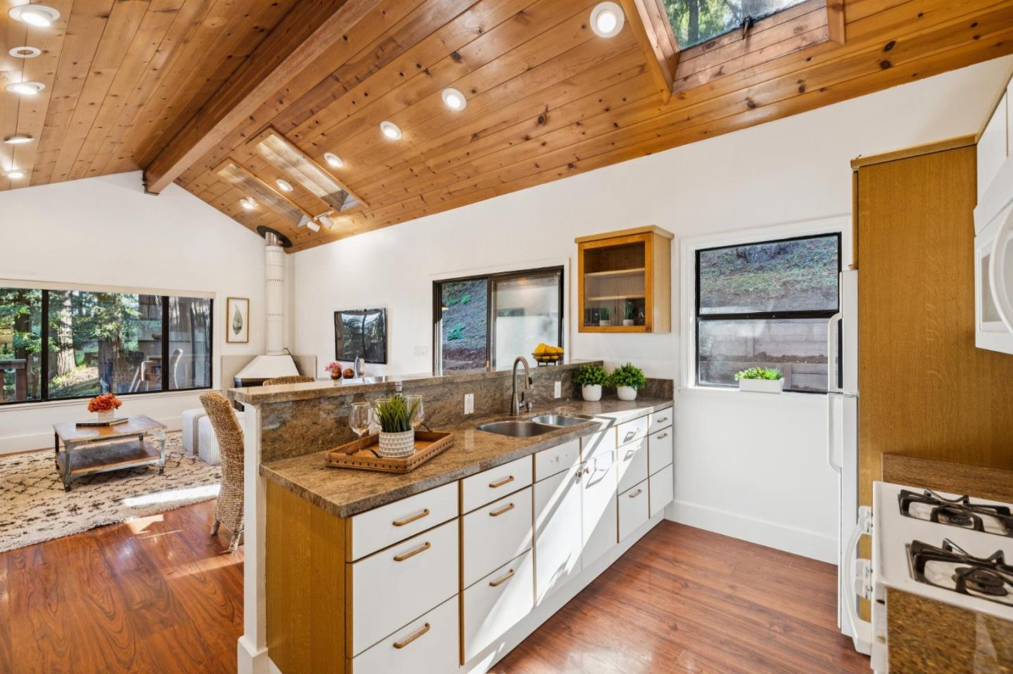 20080 Gist Road Los Gatos, CA 95033 - Photo 10 of 35 a kitchen with stainless steel appliances granite countertop a sink and cabinets