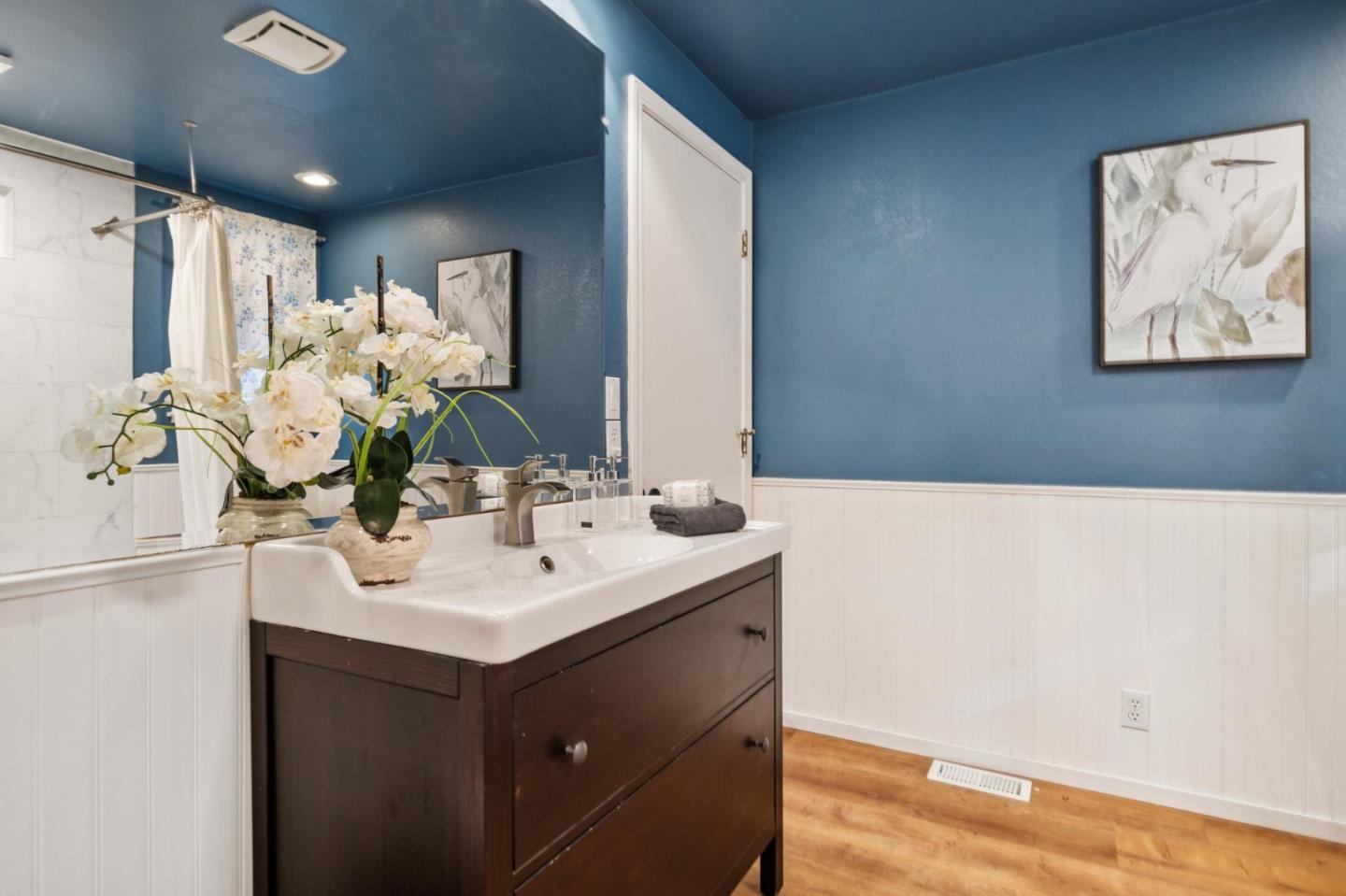 20080 Gist Road Los Gatos, CA 95033 - Photo 16 of 35 a bathroom with a sink vanity and a mirror