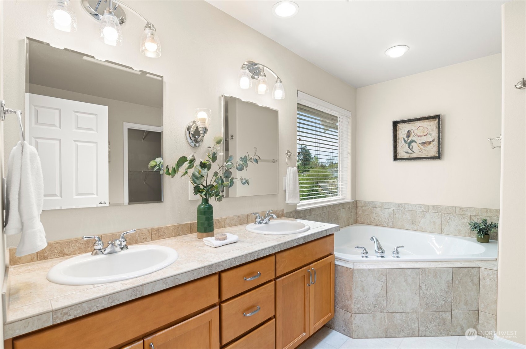23617 17th Avenue West Bothell, WA 98021 - Photo 18 of 31 a bathroom with a tub sink and mirror