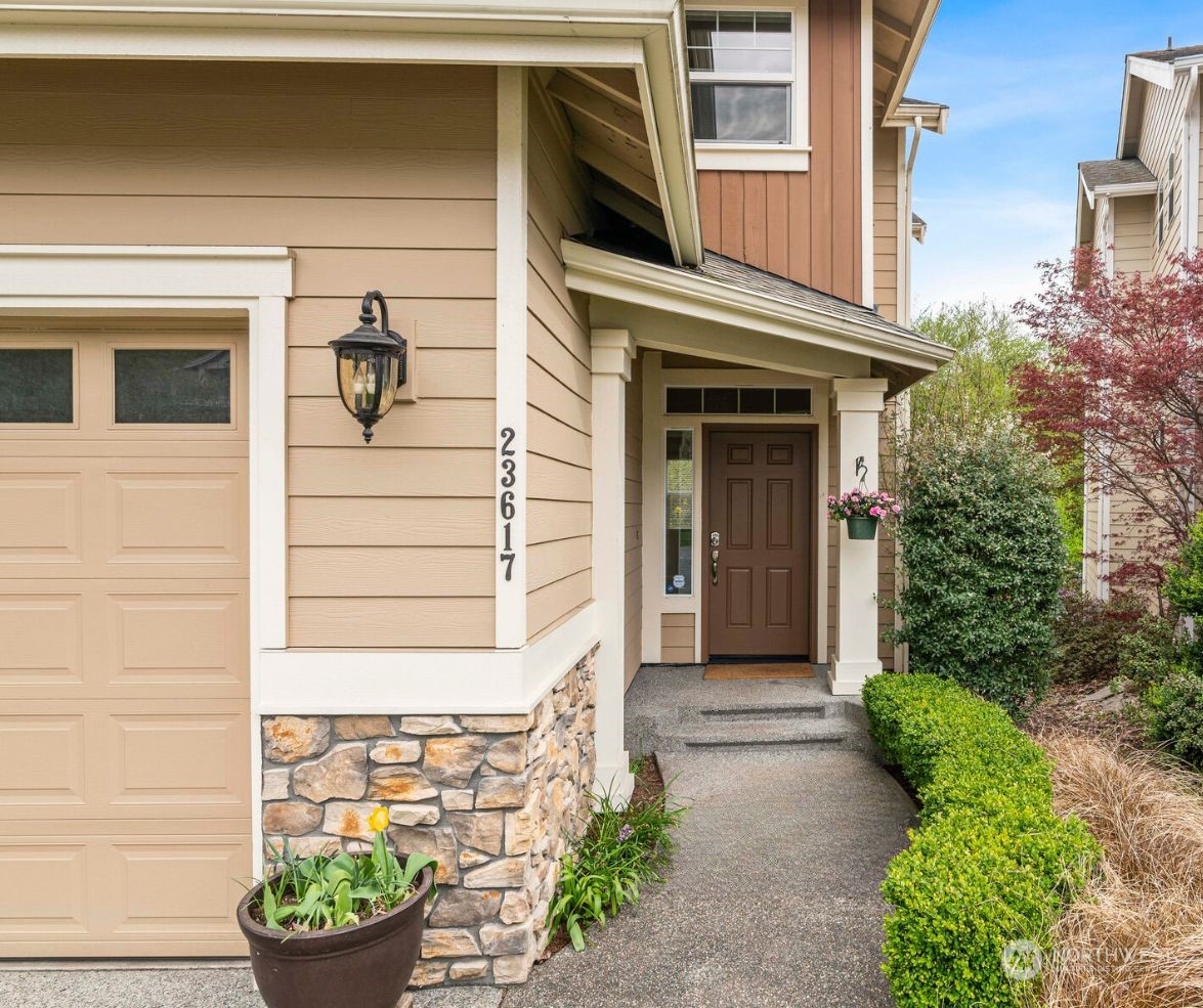 23617 17th Avenue West Bothell, WA 98021 - Photo 2 of 31 a front view of a house with a garden