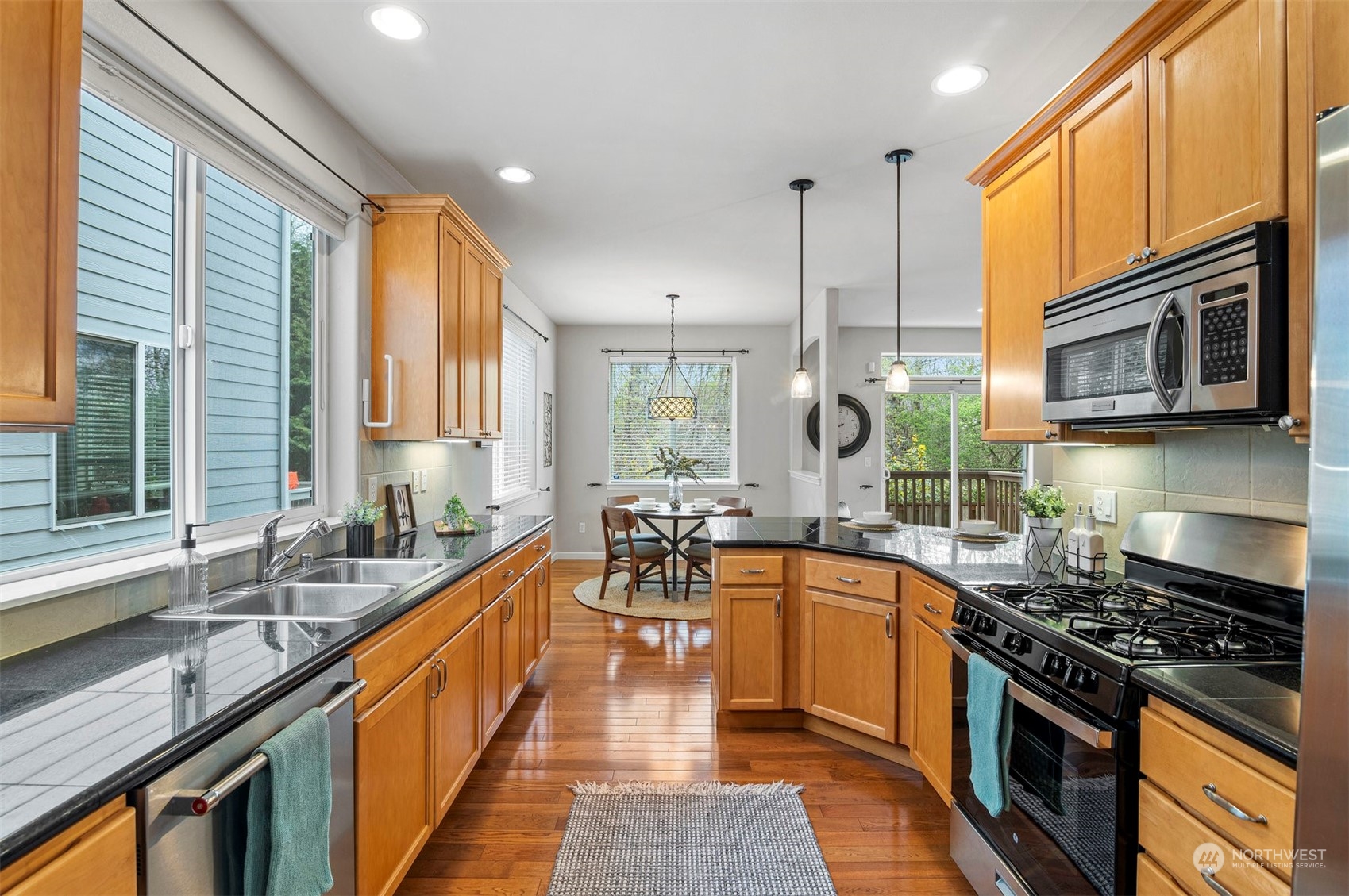 23617 17th Avenue West Bothell, WA 98021 - Photo 8 of 31 a large kitchen with stainless steel appliances granite countertop a lot of counter space a sink and a window